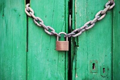 warehouse security - lock on green background